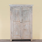Kaiden reclaimed teak wood wardrobe with hand-carved Indian details, double doors, and vintage whitewashed finish.