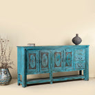 Side angle picture of Kalpana antique console table wood with turquoise patina, part of our teakwood tables collection.