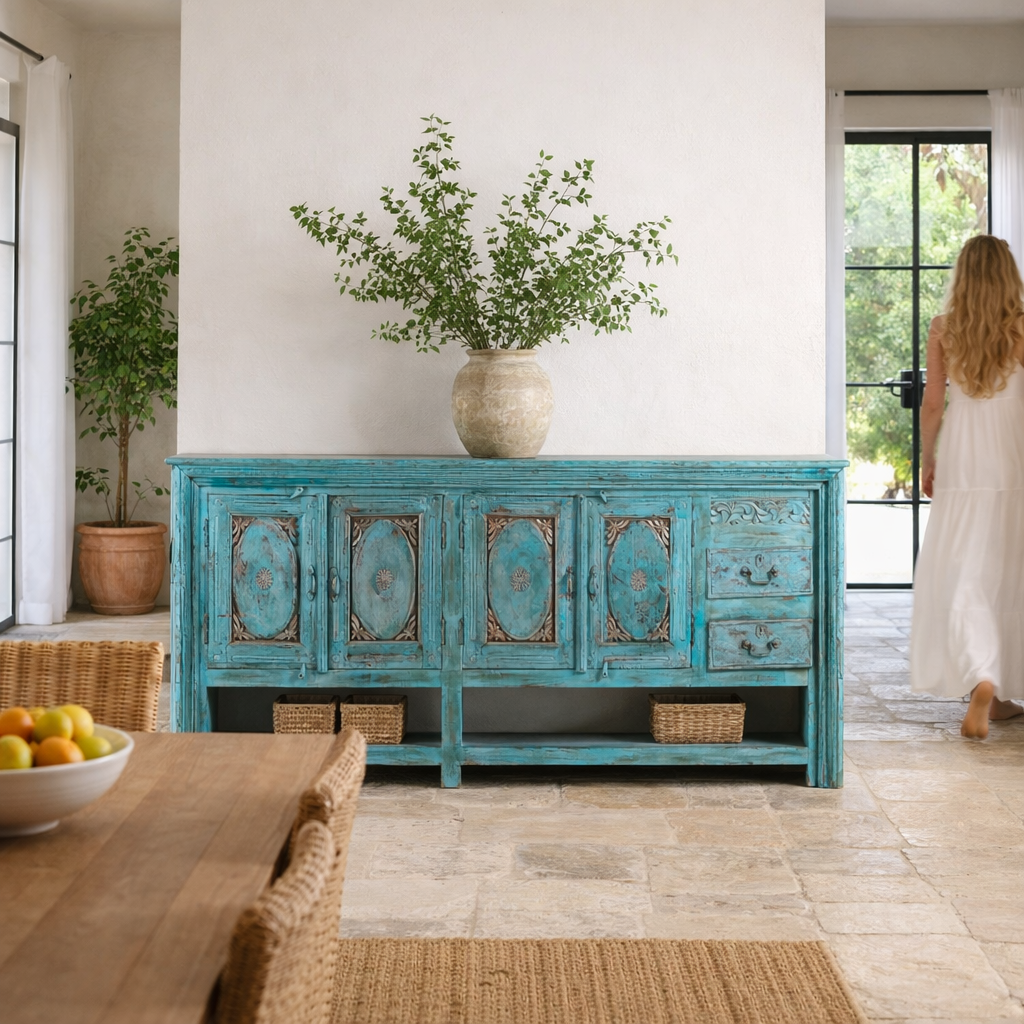 Lifestyle image of a Kalpana antique console table wood with turquoise patina, part of our teakwood tables collection.