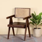 Acacia wood chair with rattan backrest and armrests; elegant wooden armchair for dining or living rooms, 55 × 55 × 85 cm.