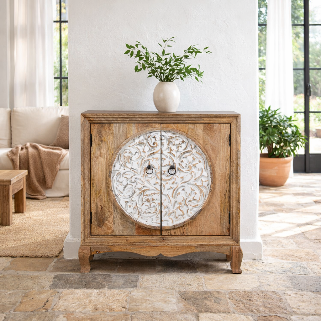 Lifestyle image of a carved wood furniture cabinet made from mango wood with floral detailing and whitewashed finish, 90 × 90 × 40 cm.