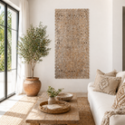 Lifestyle scene with a hand-carved whitewashed mango wood wall panel with floral design – Kataee model by Om Home & Garden
