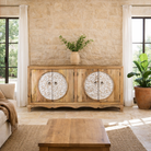 Lifestyle image of a carved wood furniture sideboard with whitewashed floral design, mango wood cabinet for boho chic living room, 180 × 40 × 90 cm.