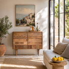 Lifestyle image of a hand-carved mango wood cabinet with 3D line-striped design and natural finish—vintage furniture blending artisanal detail and timeless style.