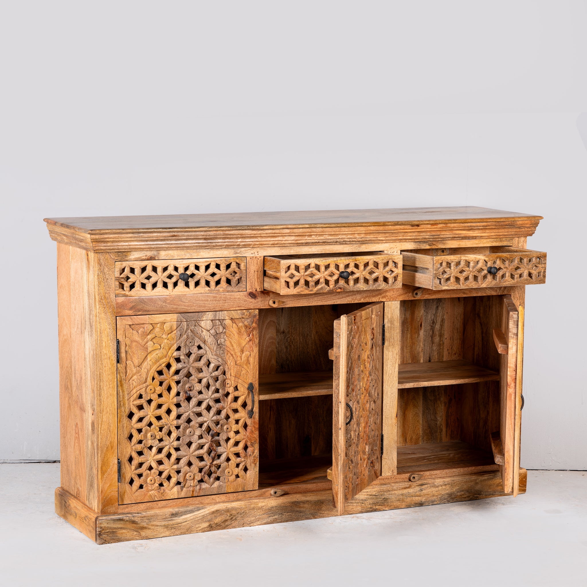 Image showing open doors of a hand-carved mango wood sideboard Kaveri with 6 compartments and 3 drawers, oriental-inspired mango wood furniture, 150 × 90 × 40 cm.