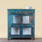 Kavish vintage blue reclaimed teak wood wardrobe with peacock reverse glass paintings and distressed Indian finish.
