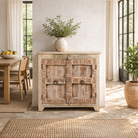 Lifestyle image of a whitewashed reclaimed teak sideboard in Ibiza style, featuring sandblasted old wood surfaces and rustic design; 112 × 90 × 50 cm.