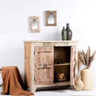 Side angle image with open door of a sandblasted reclaimed teak sideboard in Ibiza style, featuring sandblasted old wood surfaces and rustic design; 112 × 90 × 50 cm.