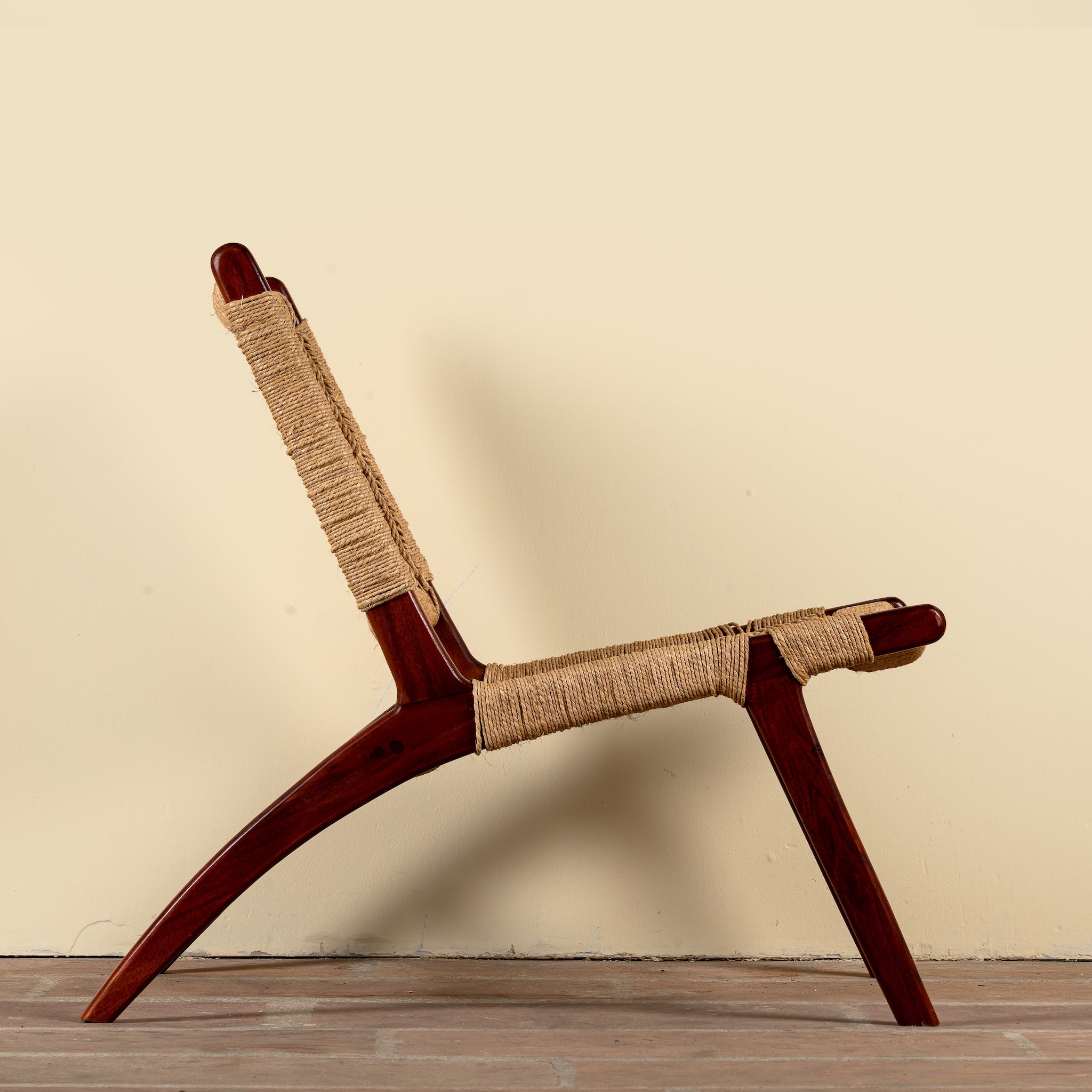 Side angle image of a Keya solid acacia wood chair with handwoven natural seagrass seat and backrest 95cm