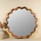Wavy round mango wood mirror Khavda with scalloped frame design. A bold wall decoration and artisan-crafted statement piece for bohemian, rustic, or modern interiors.