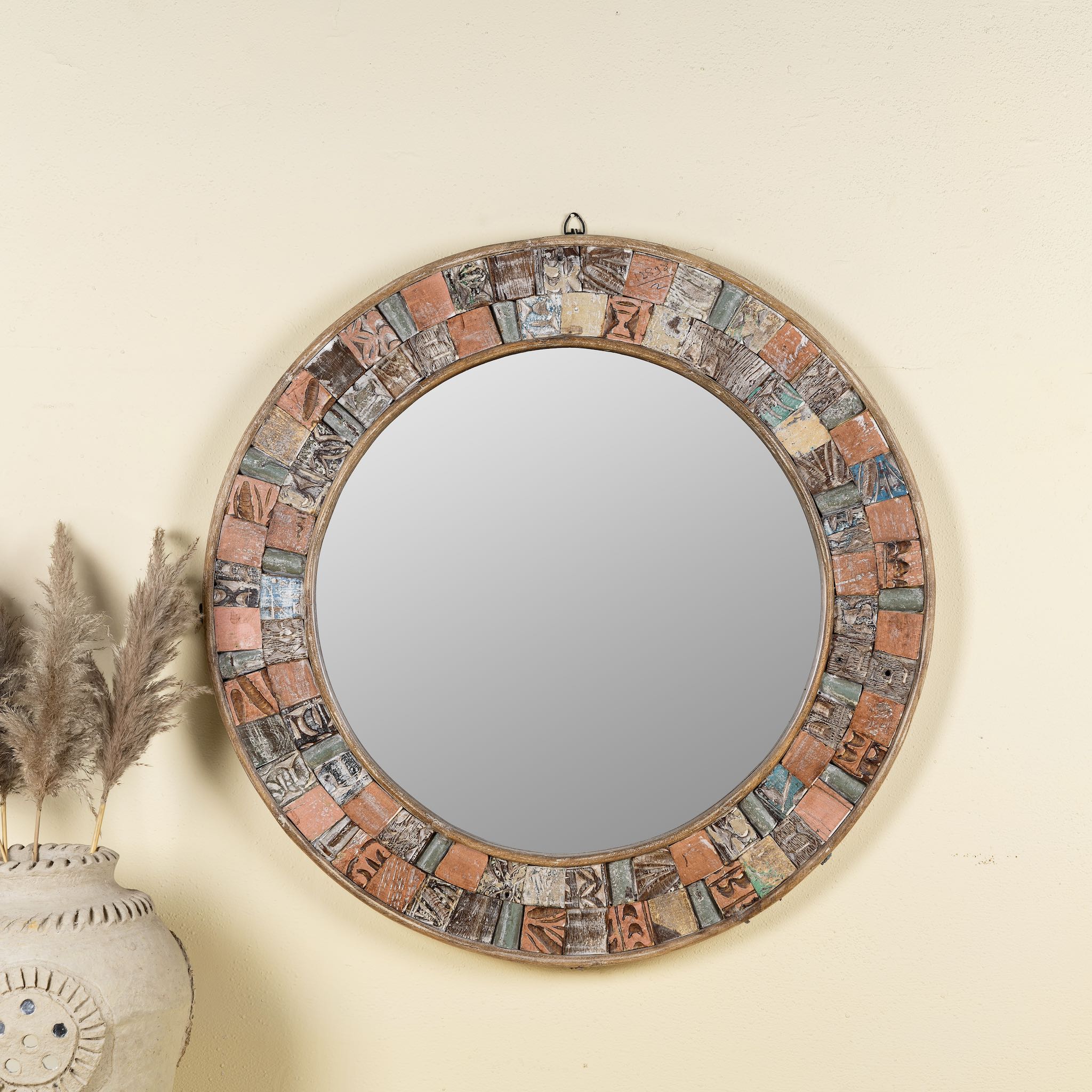 Handcrafted round mango wood mirror with patchwork reclaimed frame and distressed finish; ideal for vintage home decor, 80 × 4 cm.