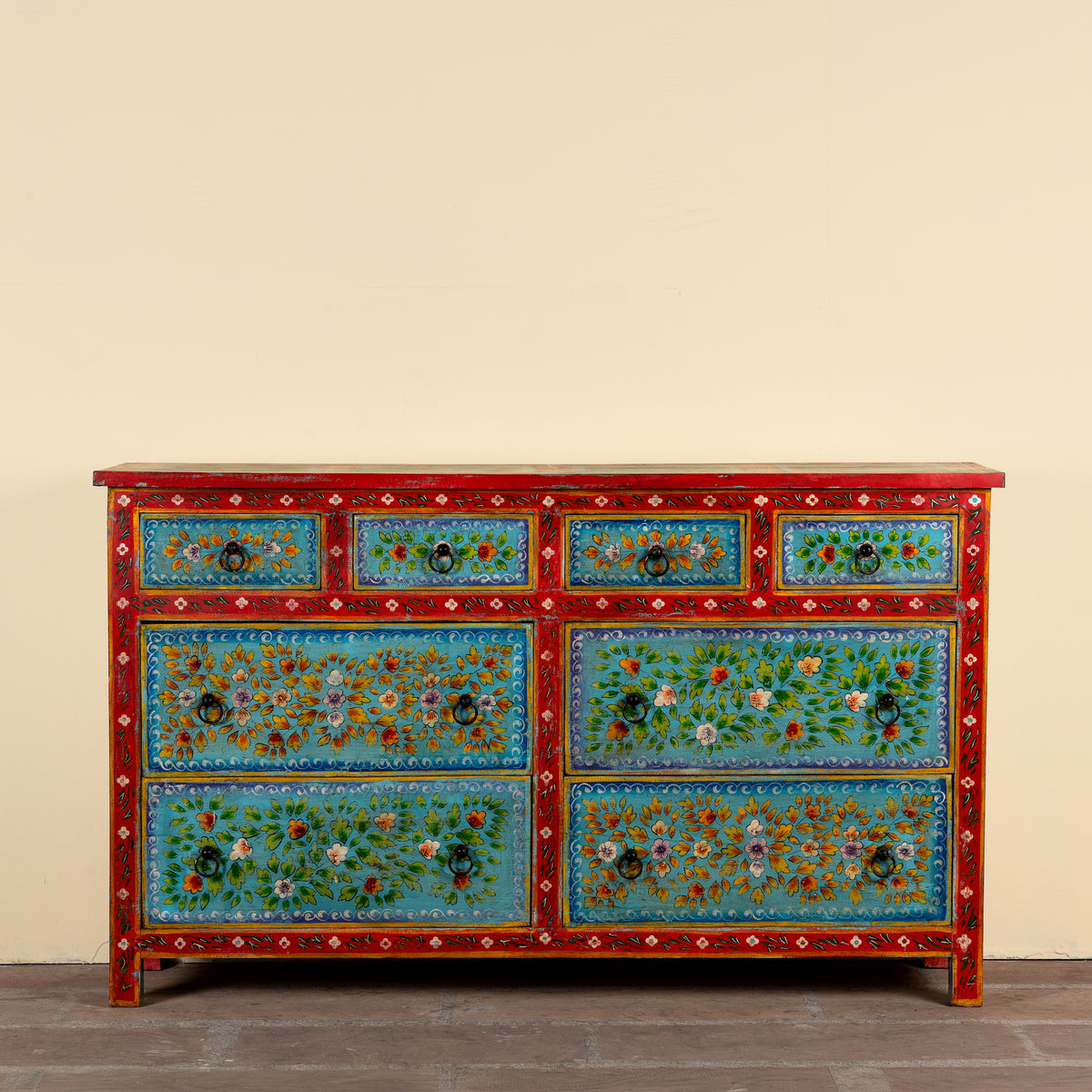 Kianraj hand painted reclaimed wood chest of drawers with red frame, blue floral fronts and eight drawers 150cm