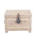 A rectangular carved wooden box in a light natural wood finish, featuring intricate floral and geometric engravings on the lid and front panel, with a dark metal padlock and chain closure on the front.