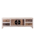 White backround image of a Kishen handcrafted reclaimed wood lowboard with driftwood front detailing, carved cabinet doors, four drawers, and natural rustic boho style finish.