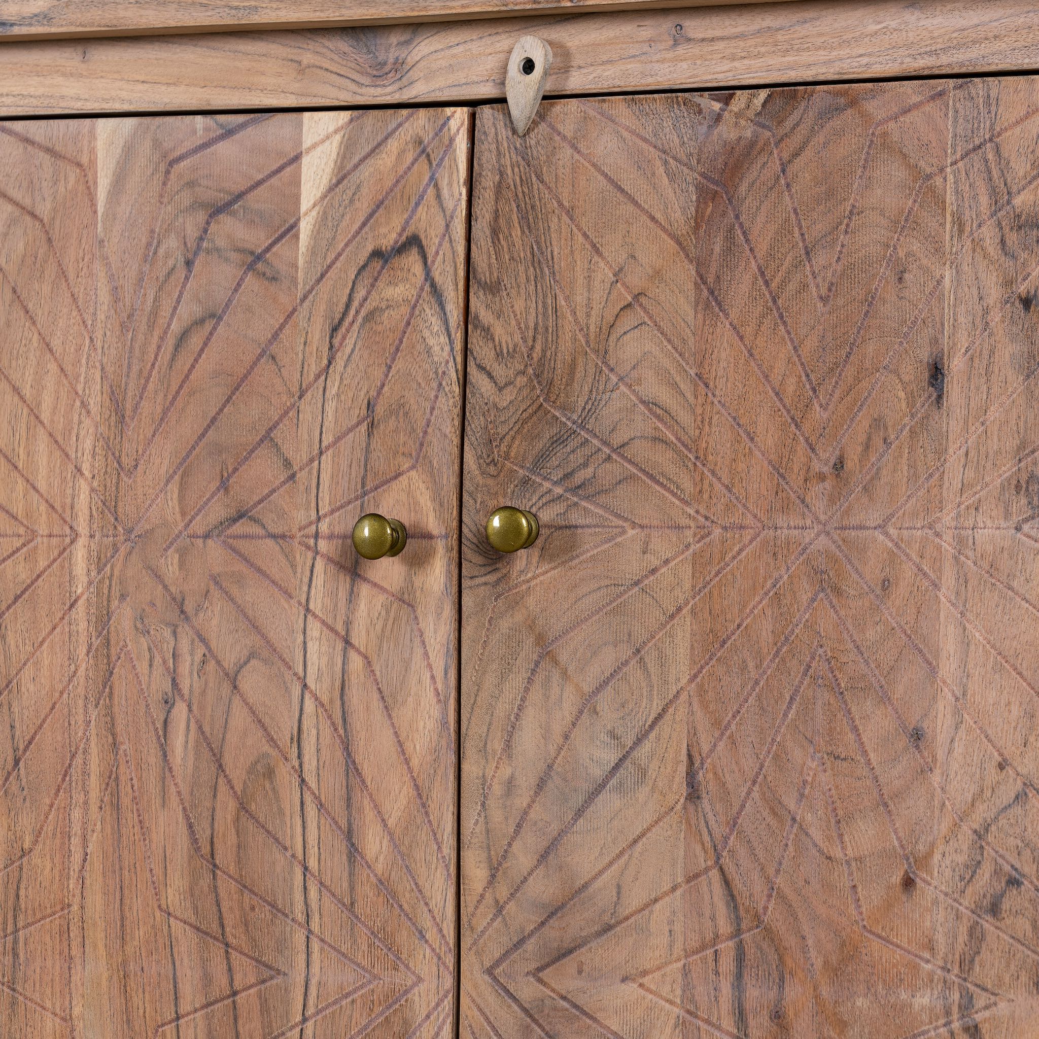 Close up picture of a sideboard with modern appeal made of acacia wood with brass fitted doorknobs and 4 doors.