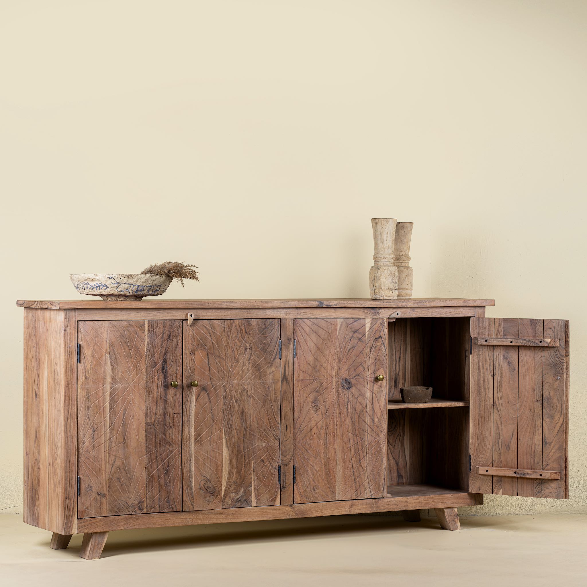 Open door picture of a sideboard with modern appeal made of acacia wood with brass fitted doorknobs and 4 doors.