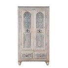 White background image of a Kyra antique reclaimed teak wood wardrobe with intricate Indian hand carvings, double doors, and vintage distressed finish.