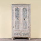 Kyra antique reclaimed teak wood wardrobe with intricate Indian hand carvings, double doors, and vintage distressed finish.