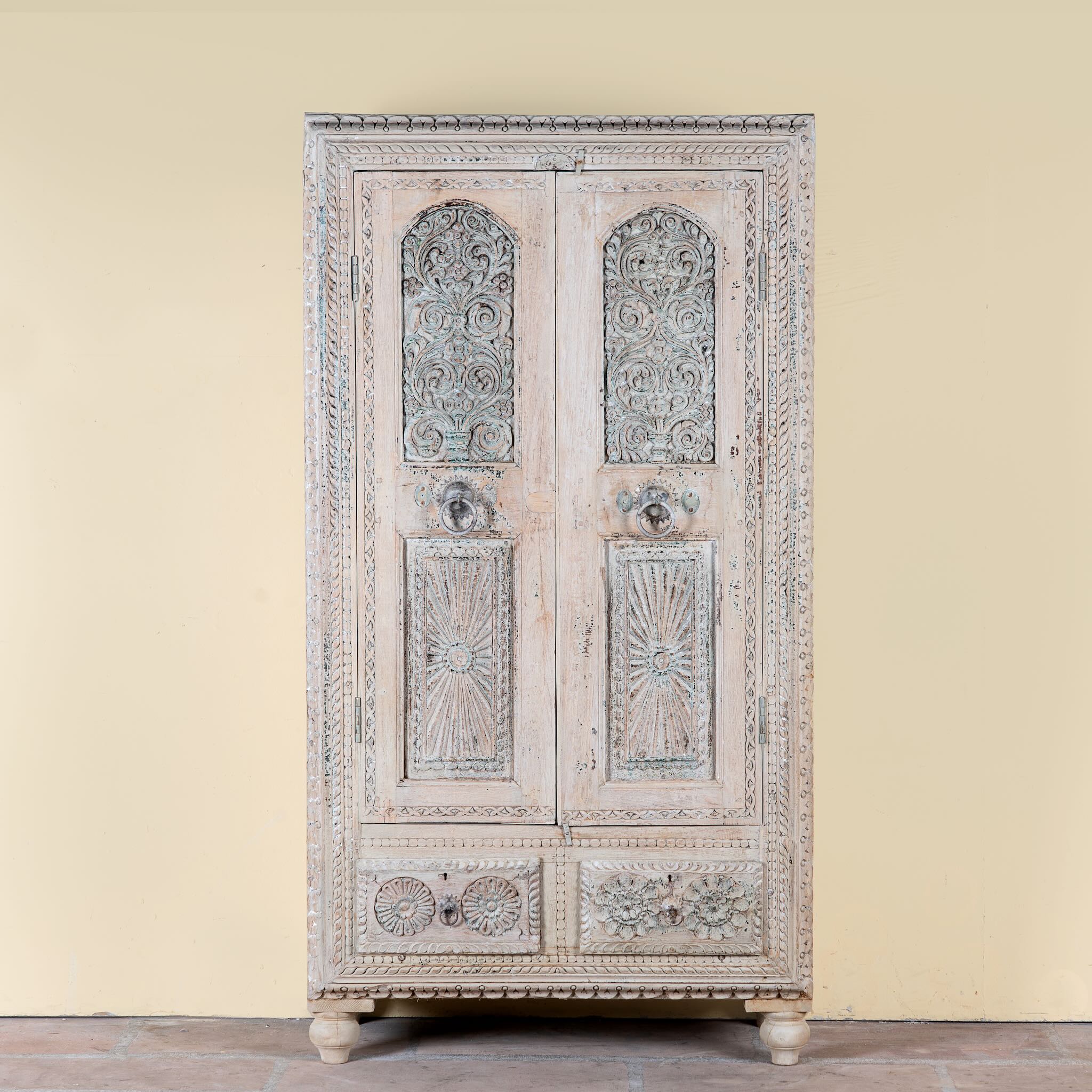 Kyra antique reclaimed teak wood wardrobe with intricate Indian hand carvings, double doors, and vintage distressed finish.