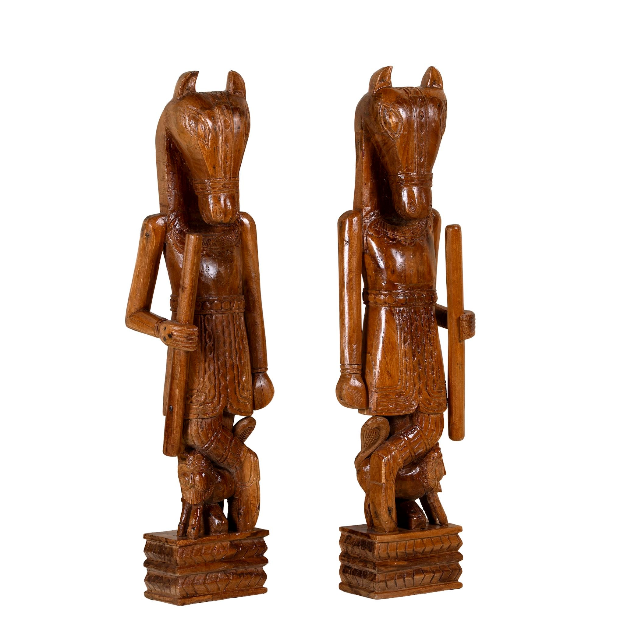 White background image of a hand-carved Indian house guardian statue in exotic style, made from reclaimed wood; sustainable furniture, 40 × 20 × 120 cm.