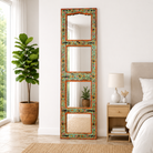 Lifestyle image of a Lalpur hand painted mirror made from a recycled teak wood furniture door, 180x53cm