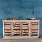 Reclaimed teak furniture sideboard with antique Indian doors, old door cabinet with hand-carved details and iron accents, 220 × 45 × 110 cm.