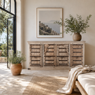 Lifestyle image of a unique old Door sideboard Laya, finely hand carved in bleached teak wood driftwood design.