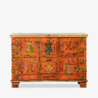 White background image of a recycled teak wood chest with hand-painted Indian motifs in orange – sustainable furniture with vibrant character and cultural craftsmanship.