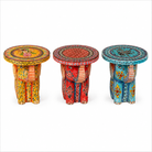 White background image of a Leo hand painted solid wood elephant side table with traditional Indian artwork, available in yellow, red, and turquoise boho style designs.