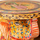 Close up image of a yellow Leo hand painted solid wood elephant side table with traditional Indian artwork, available in yellow, red, and turquoise boho style designs.