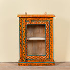 Lokesh hand-painted reclaimed wood wall cabinet with orange floral decoration, turquoise accents, glass door and interior shelf, 40x15x52cm