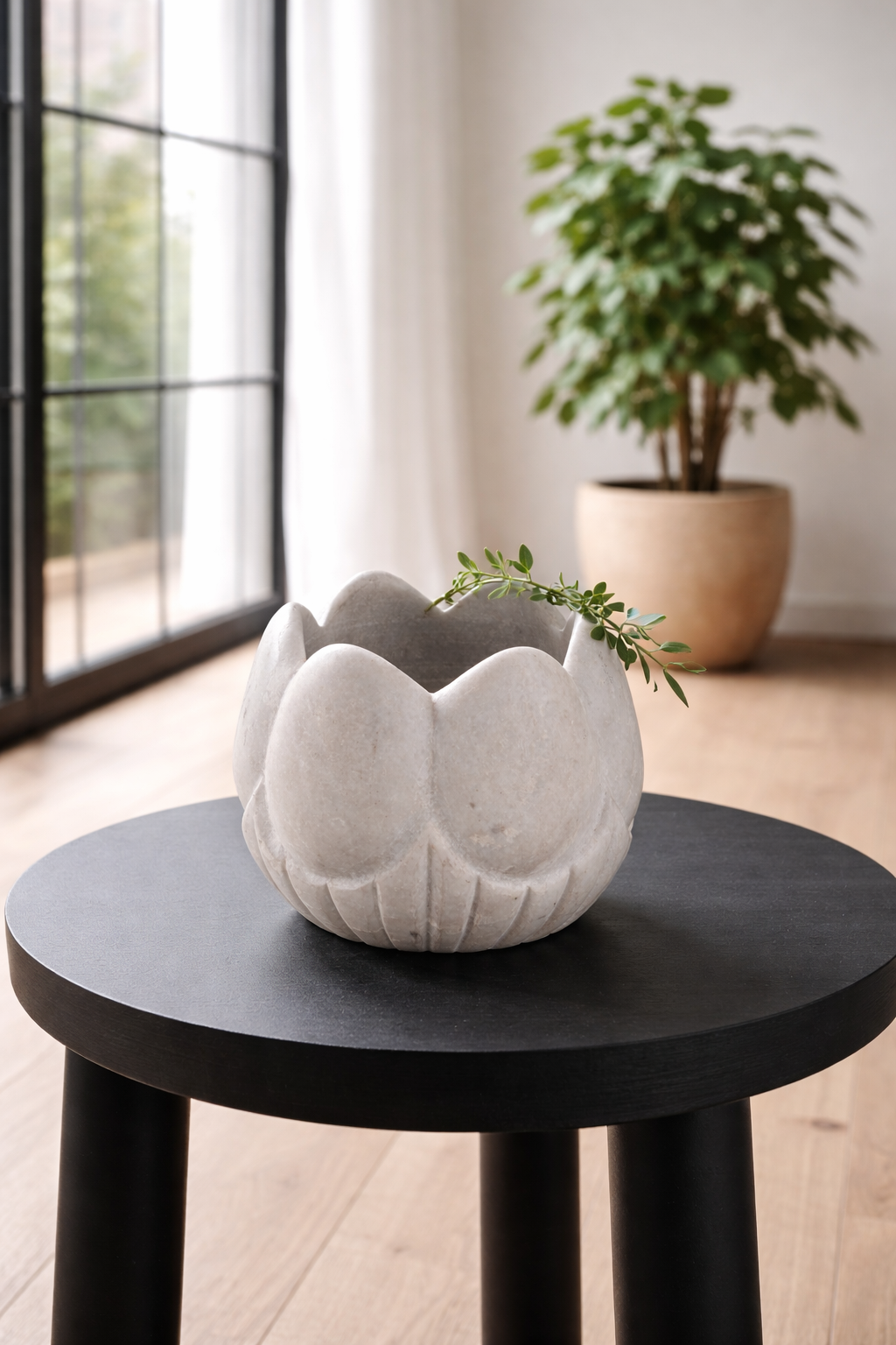 Lifestyle image of a hand-carved white marble vase Ishika in a lotus flower shape. A vintage home accessory crafted from natural stone, perfect for vintage home decor and small floral or incense displays.