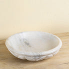 Hand-carved white marble bowl Lotus with lotus flower design. A vintage home accessory perfect for styling in vintage home decor with natural stone craftsmanship and soft grey veining.