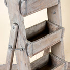Close up image of a Maahir reclaimed wood ladder shelf crafted from original Indian brick moulds, 125cm