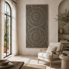 Lifestyle image of a hand-carved solid mango wood wall panel with floral designs and a striking grey-green finish, ideal as unique wall décor or a bed panel.