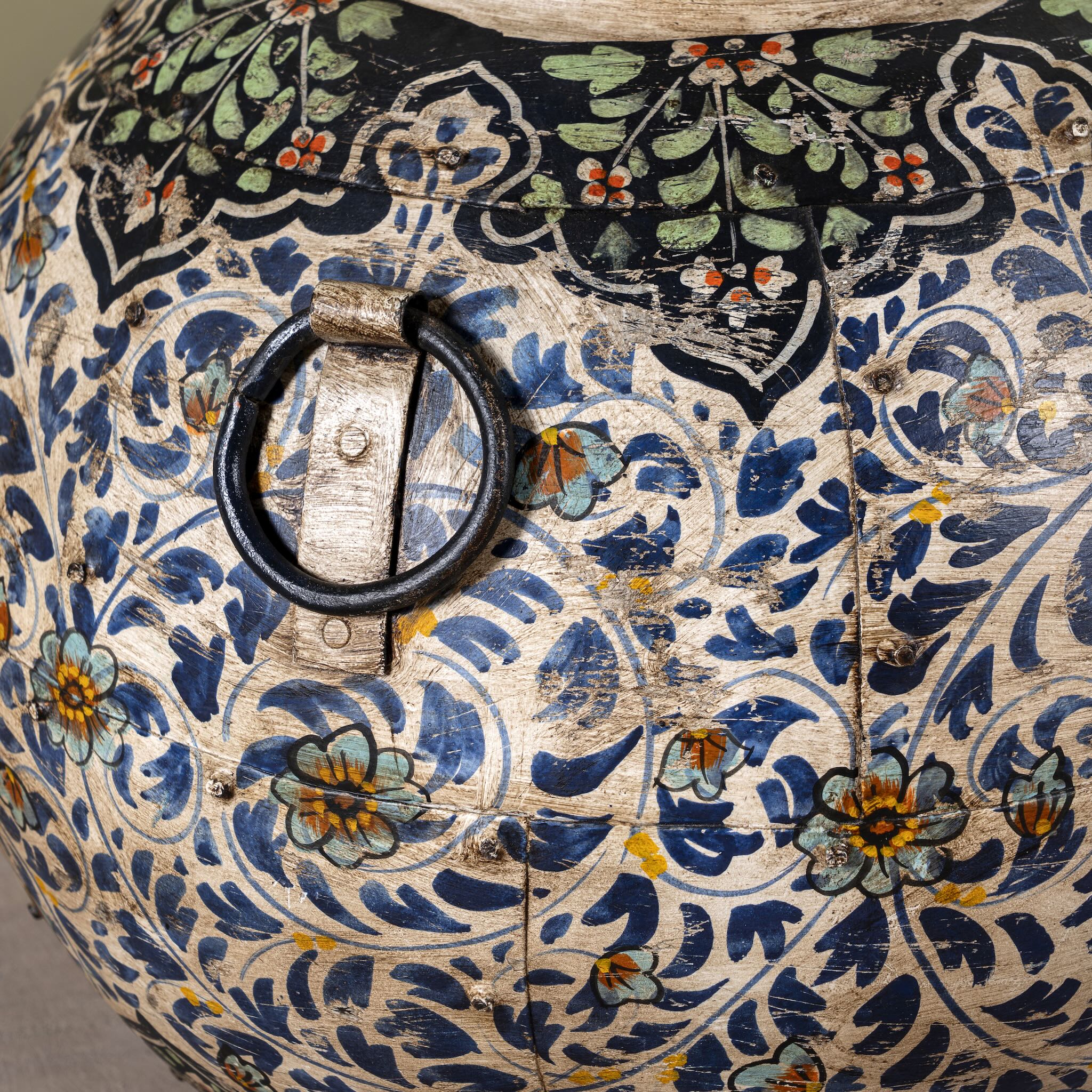 Close up image of a set of 3 round hand-painted iron pots with silver floral designs on blue background, artisanal Indian home accessories and vintage decor accents.