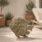 Lifestyle image of a Malini hand painted freestanding metal fish sculpture with intricate floral artwork in soft green, cream and earthy tones, handcrafted decorative home accessory, 107x15x80cm.