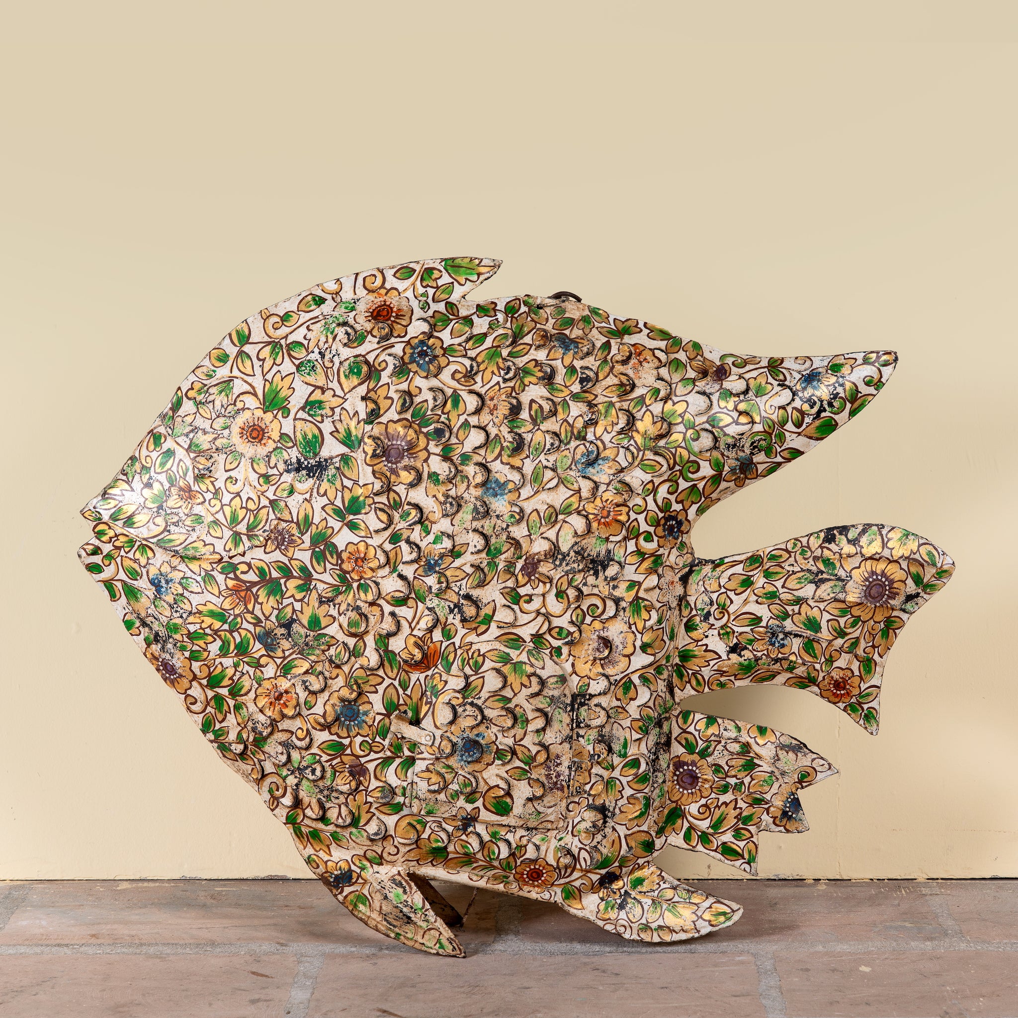 Malini hand painted freestanding metal fish sculpture with intricate floral artwork in soft green, cream and earthy tones, handcrafted decorative home accessory, 107x15x80cm.