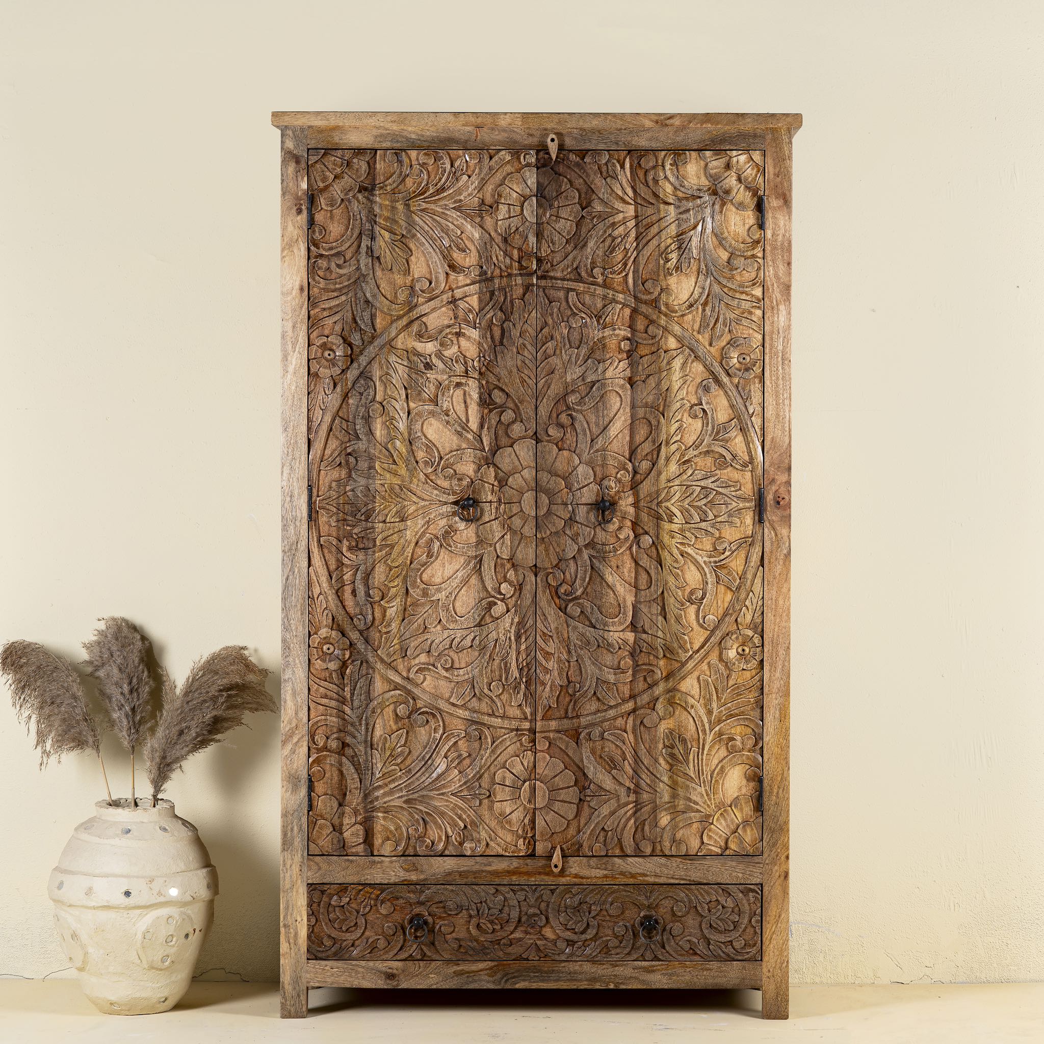 Mango wood wardrobe with hand-carved floral detailing, Indian carved wooden furniture with bottom drawer, 105 × 40 × 180 cm.