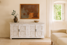 Lifestyle image of a Mango wood sideboard with hand-carved floral mandala doors; ideal for vintage home decor and mango wood furniture, 180 × 90 × 40 cm.