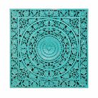 White background image of a hand-carved solid mango wood wall panel with Indian engravings and a striking green finish, ideal as unique wall décor or a bed panel.