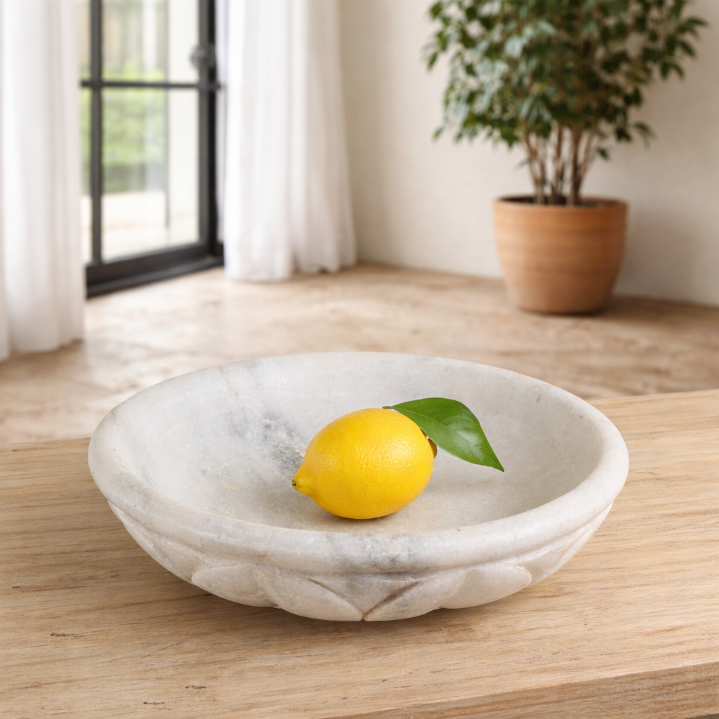 Hand-carved white marble bowl Lotus with lotus flower design. A vintage home accessory perfect for styling in vintage home decor with natural stone craftsmanship and soft grey veining.