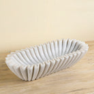 Elongated hand-carved white marble bowl with folded pleated edges – Indian decorative marble accessory.