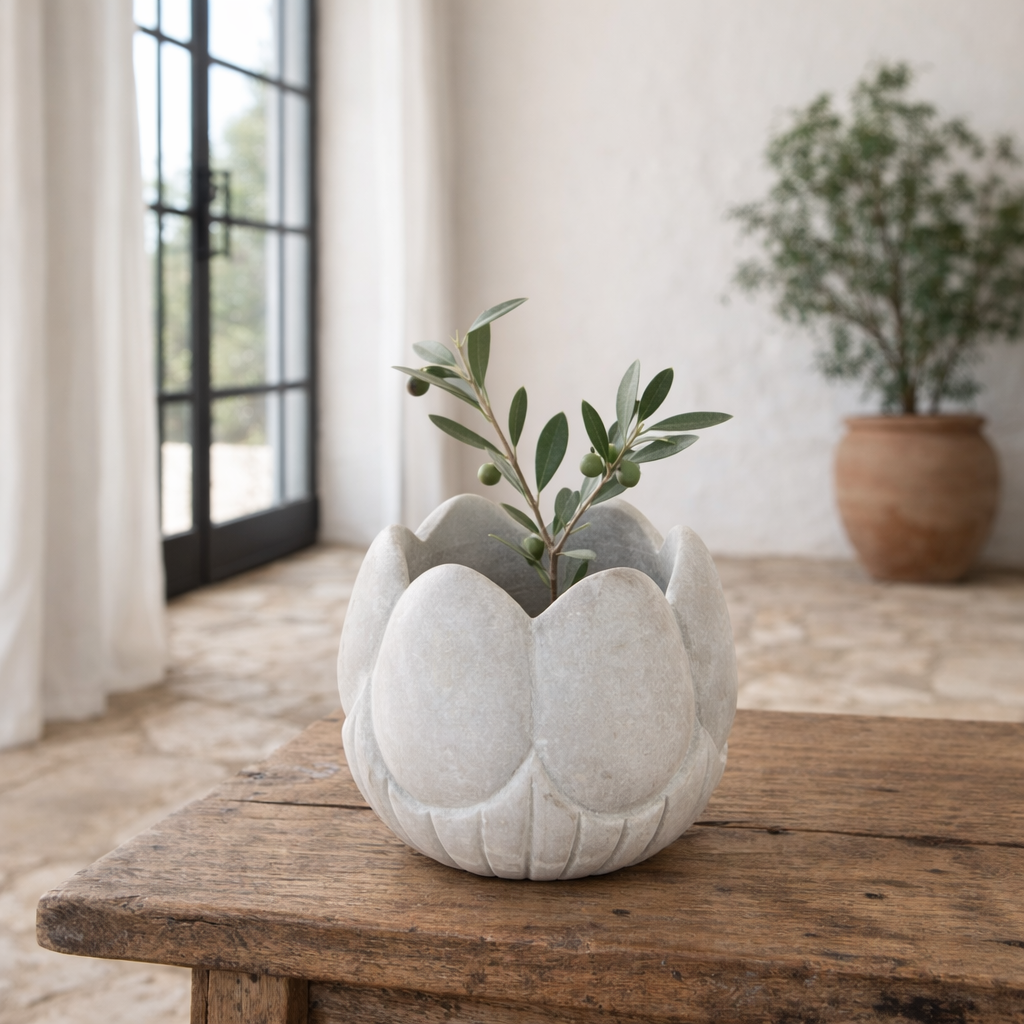 Hand-carved white marble vase Yatika in a lotus flower shape. A vintage home accessory crafted from natural stone, perfect for vintage home decor and small floral or incense displays.