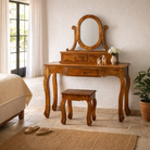 Lifestyle image of a wooden dressing table with mirror and matching chair, handcrafted mango wood table with drawers; vintage bedroom furniture, 110 × 50 × 145 cm.