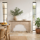 Lifestyle image of a hand carved mango wood console table in oriental style; unique hand carved furniture, 150 × 80 × 40 cm.
