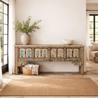 Lifestyle imagination of a Hand painted console table in reclaimed teak with floral motifs and antique distressed finish, 197 × 40 × 82 cm.