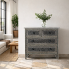 Lifestyle image of a of a of a hand-painted Indian chest of drawers made from recycled wood – unique furniture featuring colourful motifs and antique craftsmanship.