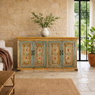 Lifestyle imagination of a hand painted wooden dresser with floral and geometric motifs, reclaimed wood living room furniture in vintage boho style, 170 × 45 × 95 cm.