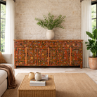 Lifestyle image of a of a hand painted sideboard made of reclaimed wood in boho design with ample storage.